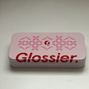 Glossier holiday tin and lidstar in shade lily.